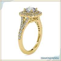 Handmade split shank diamond engagement ring with a 2 carat cushion cut and pave setting.