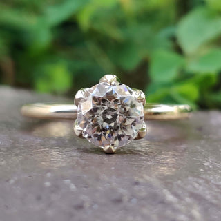 A stunning antique moissanite ring set in a timeless design, perfect for vintage jewellery enthusiasts.