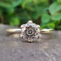 A stunning antique moissanite ring set in a timeless design, perfect for vintage jewellery enthusiasts.