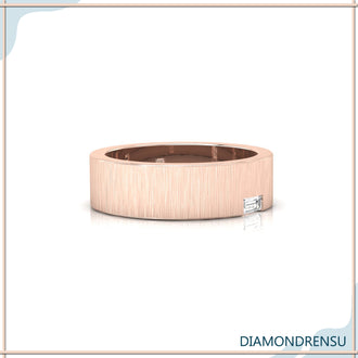 Baguette cut diamond wedding band with a unique brush finish gold.