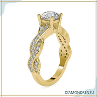 Classic twisted ring featuring a round cut diamond in a 4 prong ring setting.
