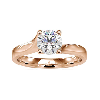 Bypass solitaire engagement ring in gold with lab grown diamond.