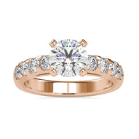 Round brilliant cut diamond ring with hidden halo design and prong setting.