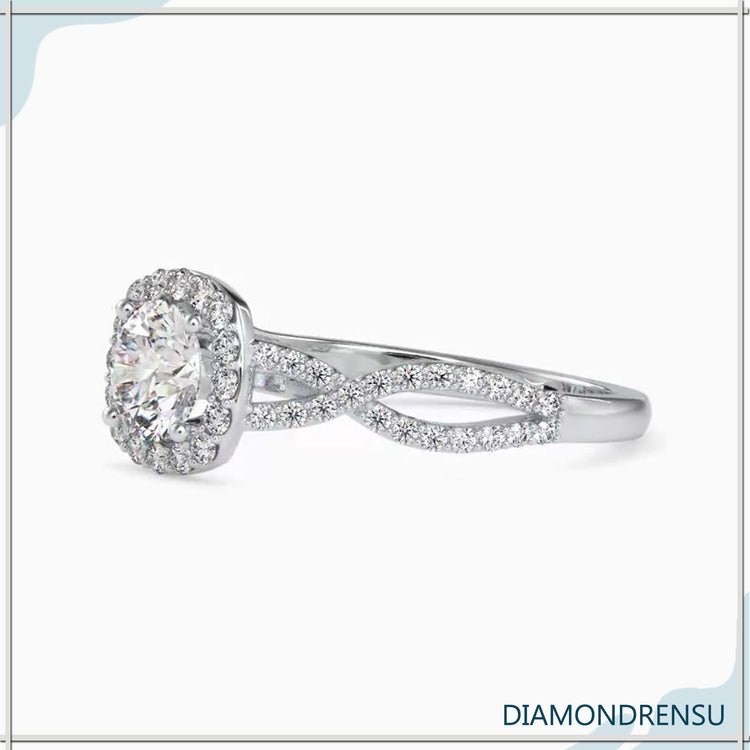 Engagement ring round cut halo with twisted pave diamond design.