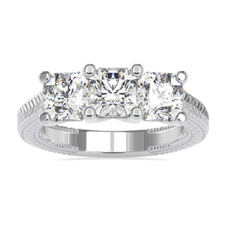 Three stone engagement ring diamond with radiant cut in prong setting.