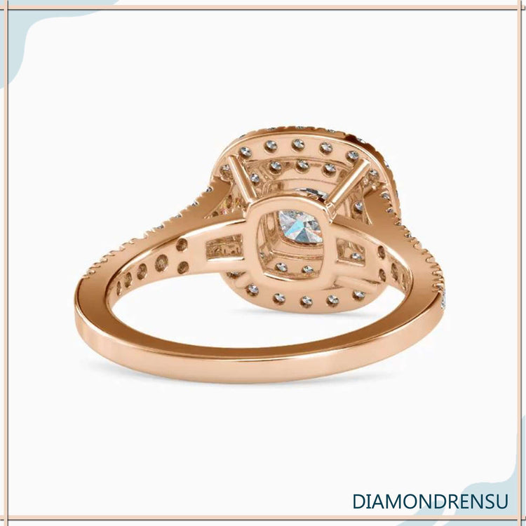 Handmade ring with a split shank halo engagement ring design and a four prong ring setting.