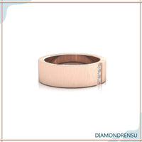 Three stone engagement ring and wedding band, rose gold setting.