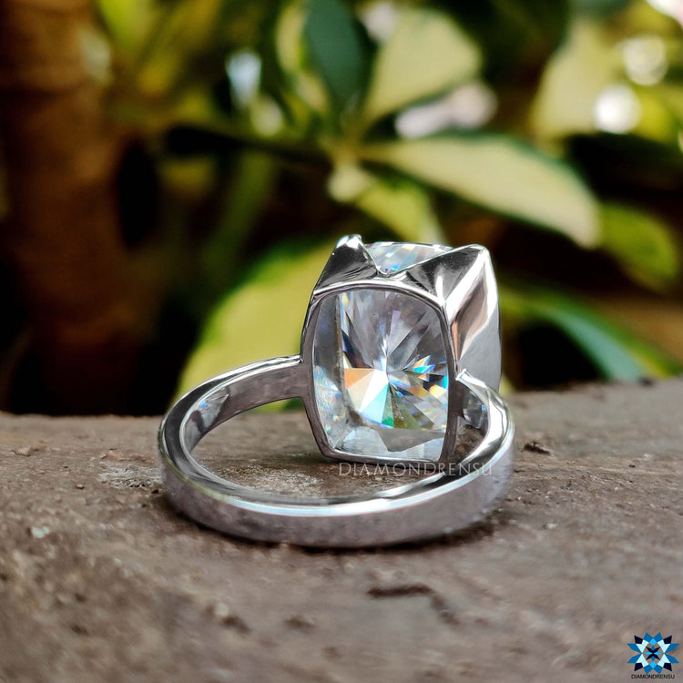 Half bezel cushion cut ring showcasing timeless beauty.