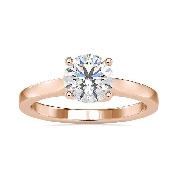 Round solitaire ring in rose gold, white gold, or yellow gold.