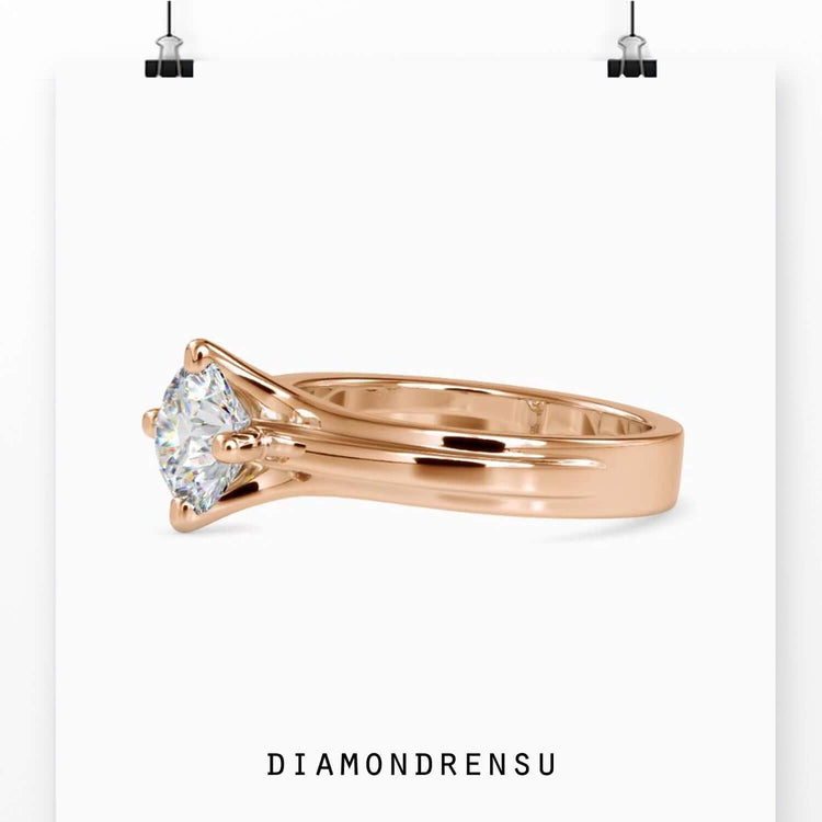 Compass setting engagement ring offering a modern and secure design.