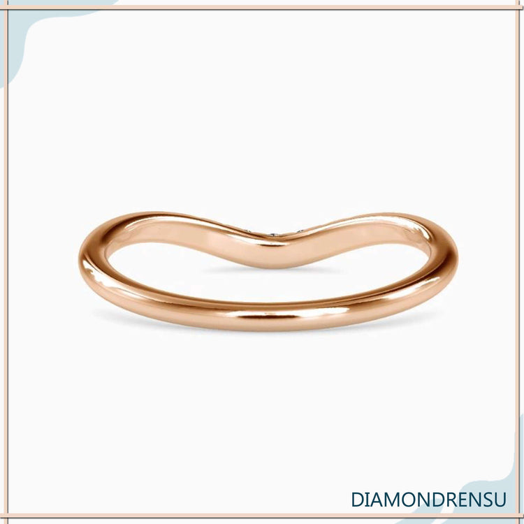 Rose gold curved wedding band with seven round diamonds