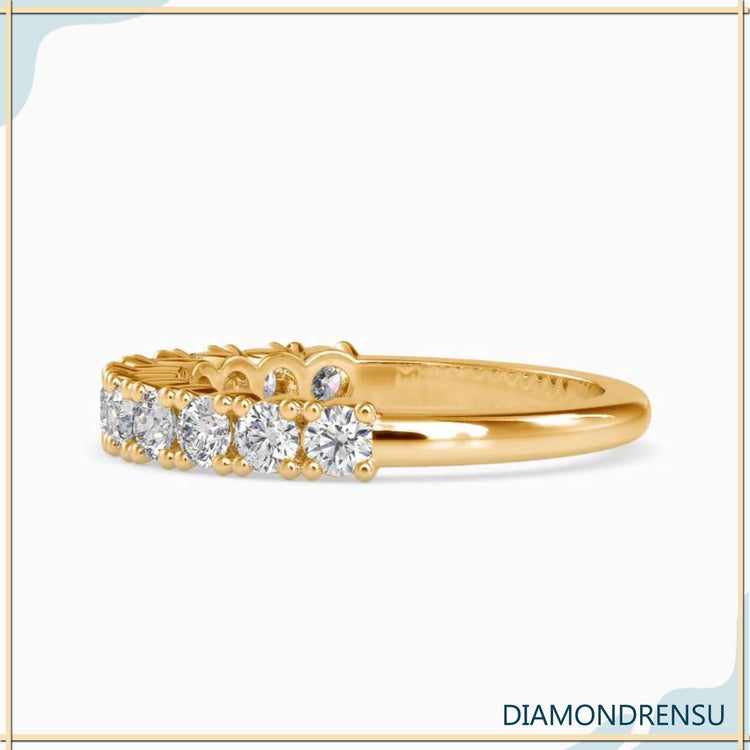 Handmade half eternity band with shared prong setting and IGI certified diamonds.