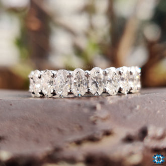 Exquisite oval band with a modern prong setting, allowing the moissanite brilliance to shine.