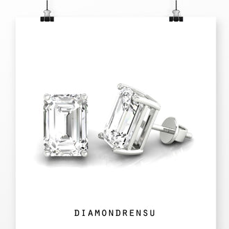 Elegant 4 carat emerald cut diamond stud earrings, handcrafted for timeless beauty.