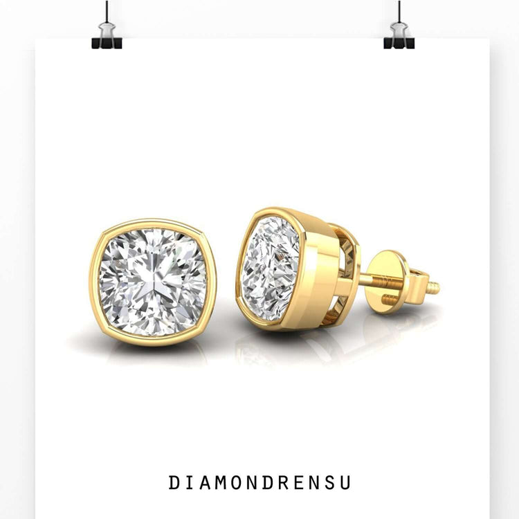 Beautiful bezel set earrings with cushion cut diamonds, offering a secure fit and sparkle.