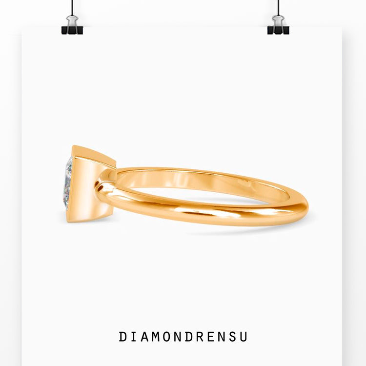 Beautiful bezel princess cut engagement ring with a solitaire design.