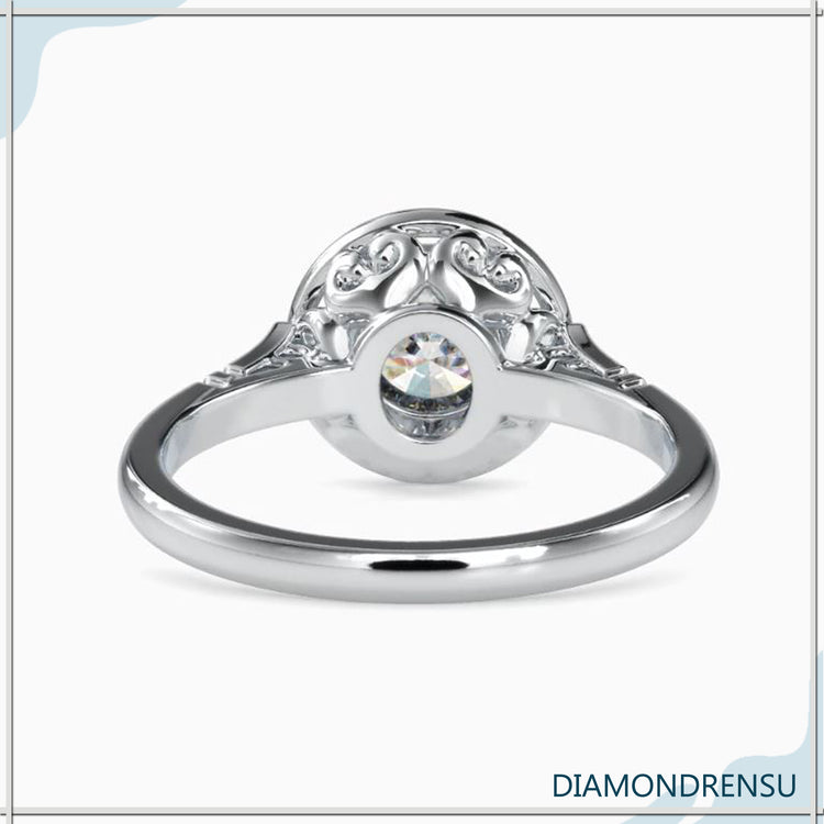 Diamond solitaire set in a filigree engagement ring, elegant and unique.