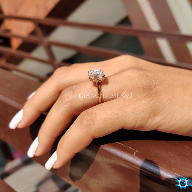 Cushion solitaire engagement ring in a stunning cathedral setting.