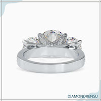 Round brilliant cut diamond ring with a chic side stone design.