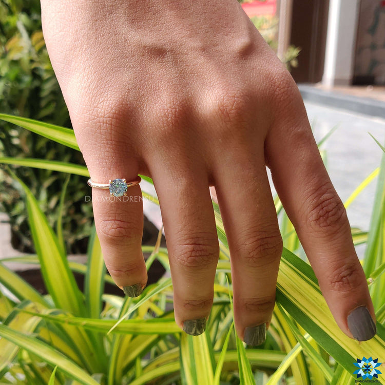 Luxurious handmade ring with a brilliant moissanite round cut stone.