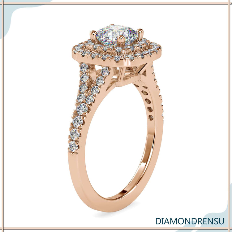 Diamondrensu engagement ring with a split shank pave band and a diamond cushion cut with halo.