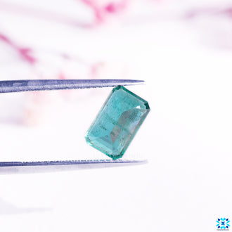 May birthstone emerald in emerald cut gemstone form.