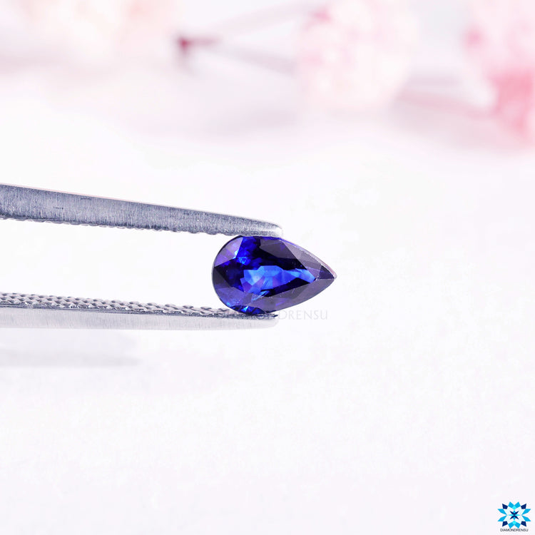 0.54 carat gemstone offered as pear birthstone and blue gemstone.