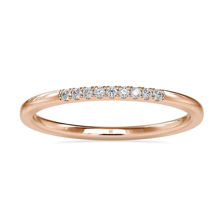 Round diamond gold band with minimalist design in yellow gold.