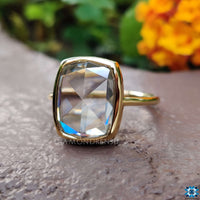 A radiant cushion ring adorned with delicate details, making it ideal for proposals.