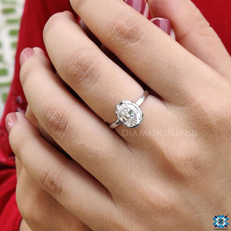 Handmade bezel engagement ring with an elegant design.