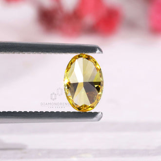 Lab grown diamond in oval cut and yellow color, 0.70 carat weight.