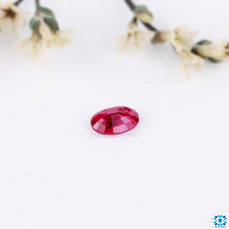 Oval cut gemstone categorized as 0.53 carat gemstone and ruby gemstone.