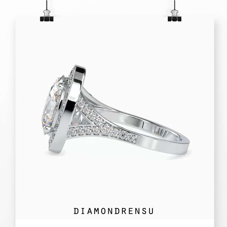 Engagement ring oval cut diamond in a split shank and halo setting