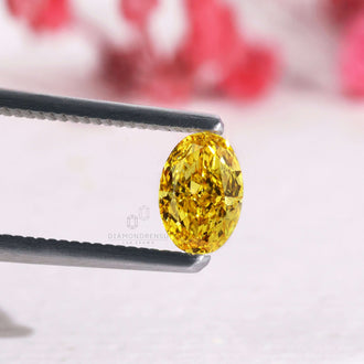 This oval cut yellow diamond is fancy vivid and lab grown.