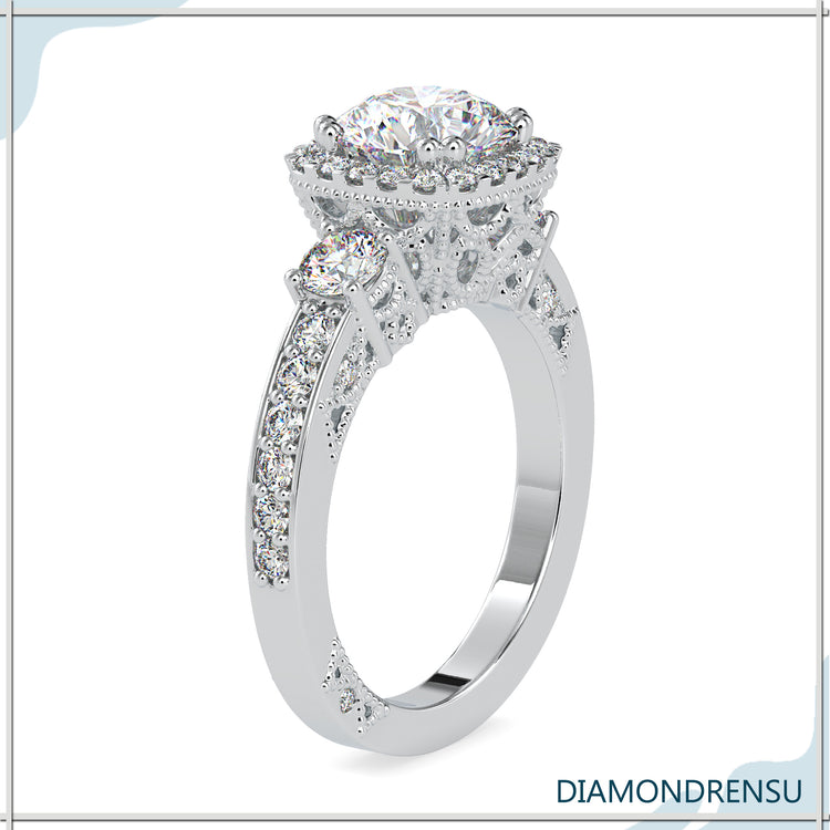Three stone ring with a beautiful round brilliant cut diamond center.