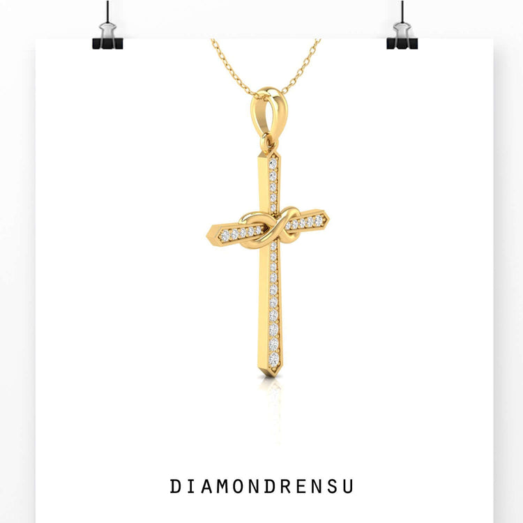 This gold cross pendant shines with elegance and warmth.