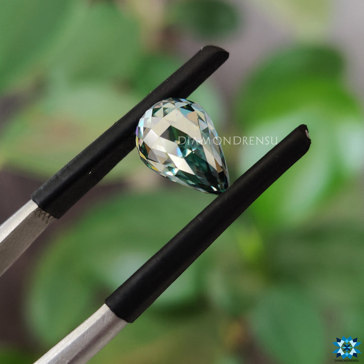 Cyan blue moissanite selected for its bright tone.