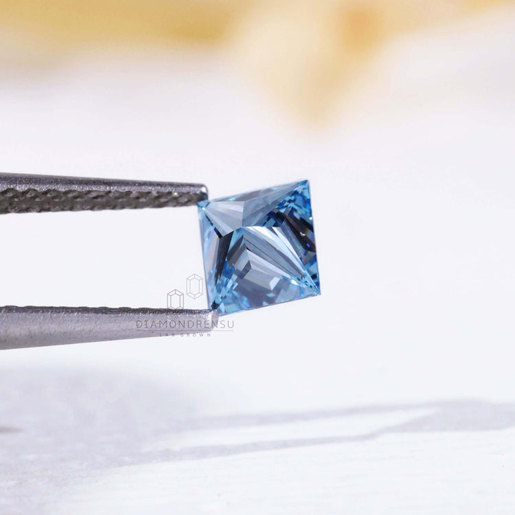 Blue diamond offered in princess cut with high grade clarity and color.
