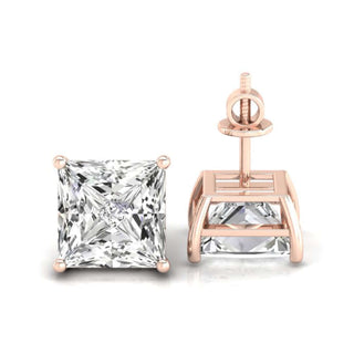 Princess cut diamond earrings set in a four-prong basket setting, perfect for a luxurious look.