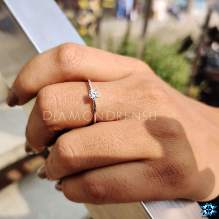 Unique round moissanite ring with a brilliant shine.