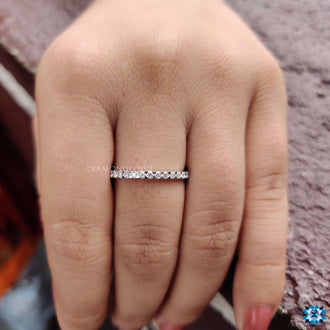 Round cut eternity band showcasing intricate craftsmanship.
