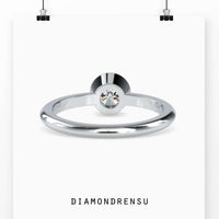 Modern round bezel set engagement ring in white gold for a sleek and elegant style.