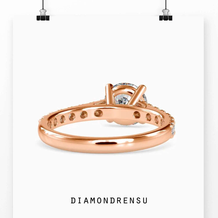 Pave engagement ring featuring a cathedral setting and a handmade diamondrensu engagement ring.