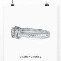 2 carat radiant cut diamond ring with prong setting in white gold.