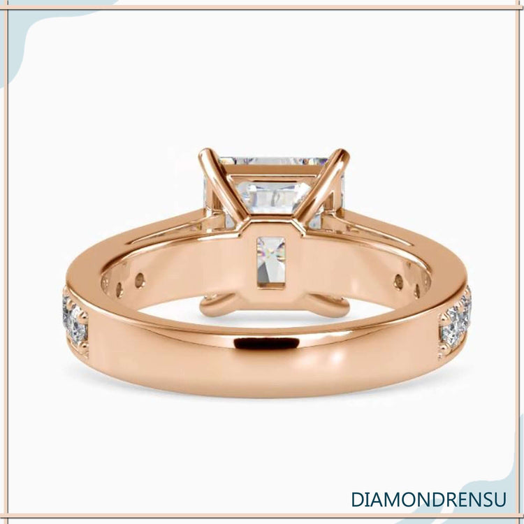 A diamondrensu ring in yellow gold with a radiant cut moissanite and a stunning pave ring setting.