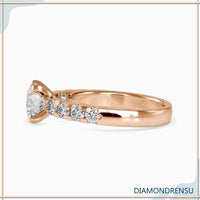 Round brilliant cut diamond in a pave engagement ring with classic style.