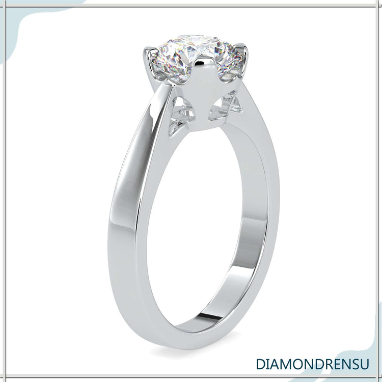 Round solitaire ring with a classic basket setting.