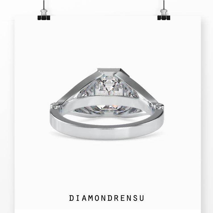 Pave engagement ring with an emerald cut diamond and sidestones