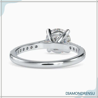 Cathedral style engagement ring with a pave engagement ring setting and a Lab Grown Diamond.