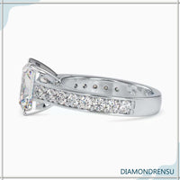 A moissanite radiant cut ring in a cathedral ring setting, blending classic and contemporary styles.